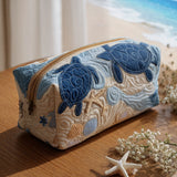 Gesteppte Kosmetiktasche mit blauen Muscheln