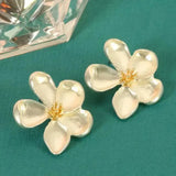 Goldene Blumenohrringe
