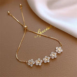 Margeritenarmband mit Kristall in Gold