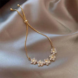 Margeritenarmband mit Kristall in Gold